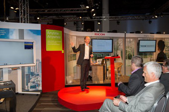 Delegates visit the ‘Anytime, Anywhere’ podium, which includes a presentation on mobile working 